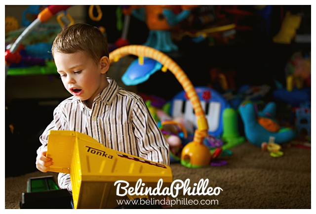 toddler playing with his tonka truck