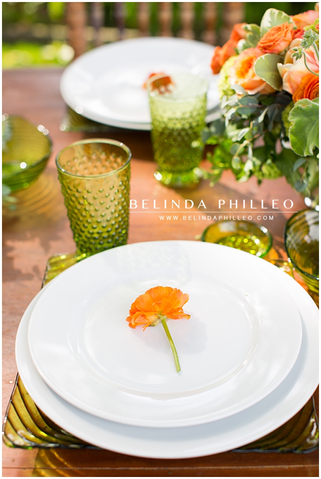 Orange Rose place settings at an outdoor reception