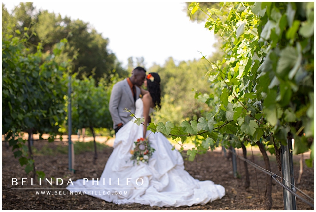 bride and groom sharing an intimate moment in a vinyeard