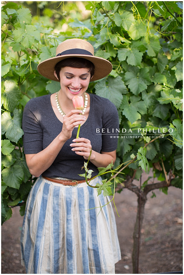 Woman holding a tulip and laughing