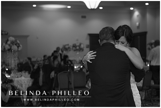 tearful bride dances with her father at her wedding reception