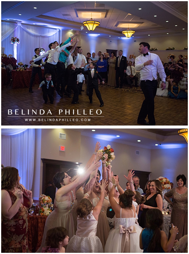 bridesmaids dive for the bride's bouquet at the wedding reception