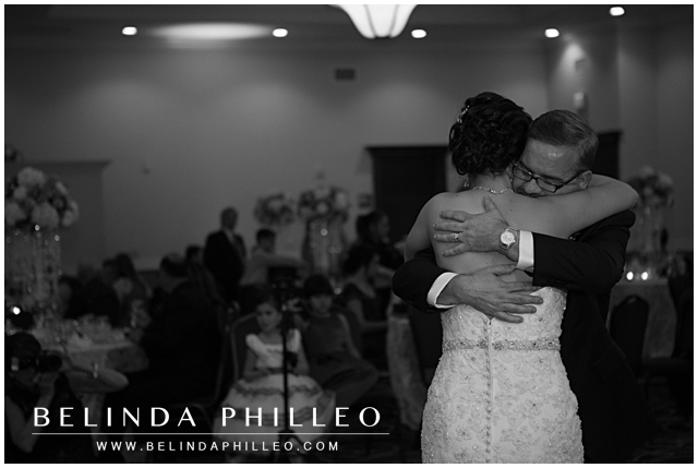 father dances with his daughter at her wedding reception
