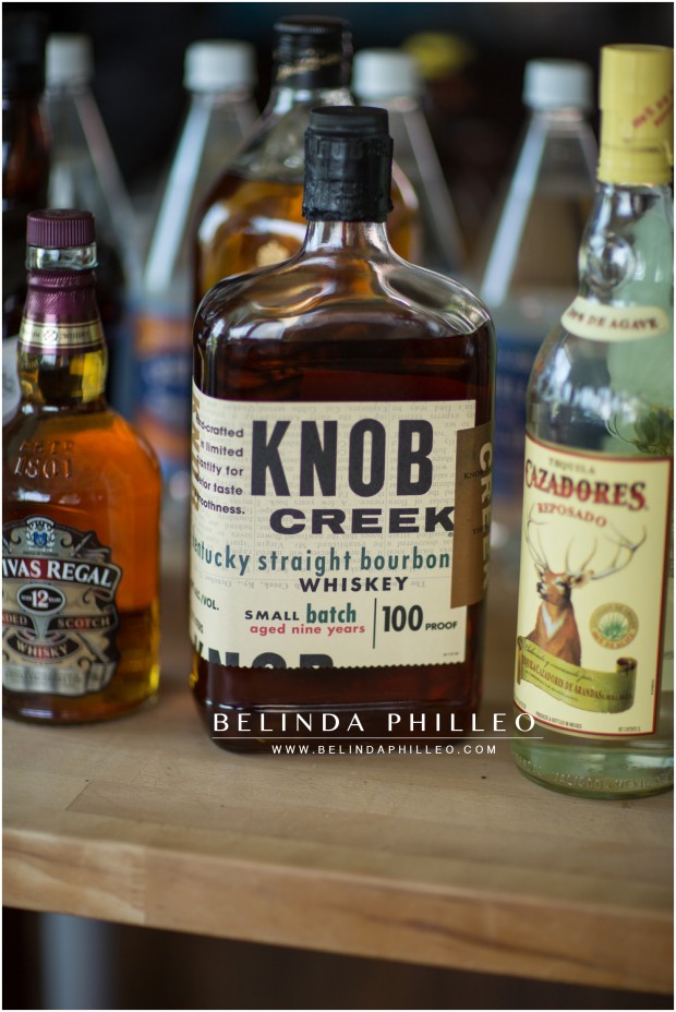 a groom and his groomsmen take shots of knob creek whiskey