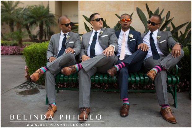 groomsmen show off their colorful socks at the Anaheim Marriott