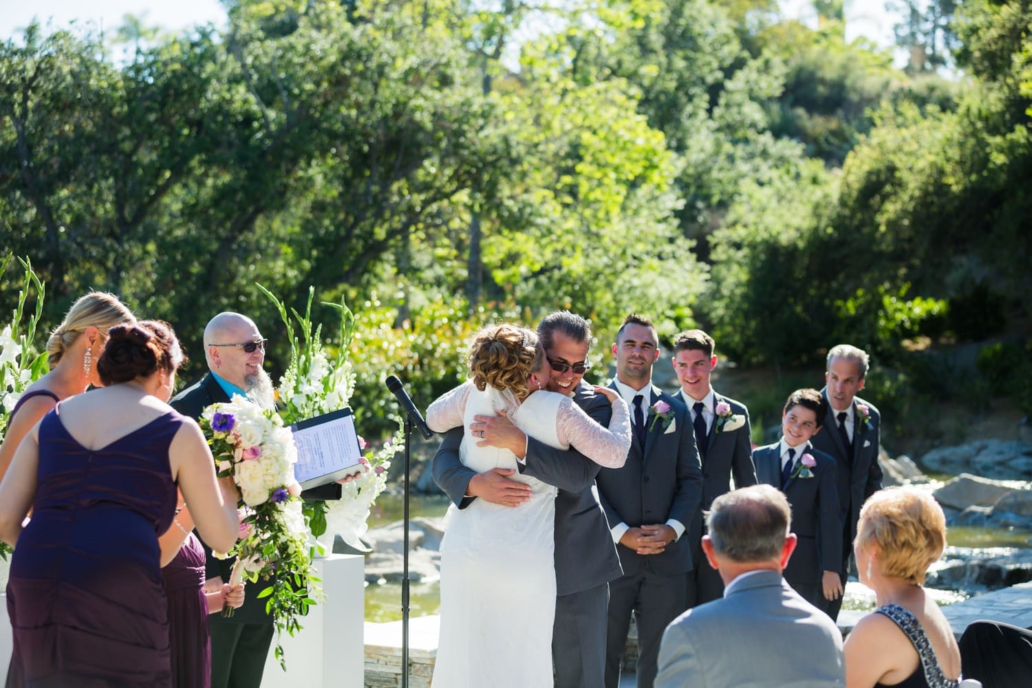 Newlyweds share a hug during their ceremony at their Dove Canyon Golf Club wedding