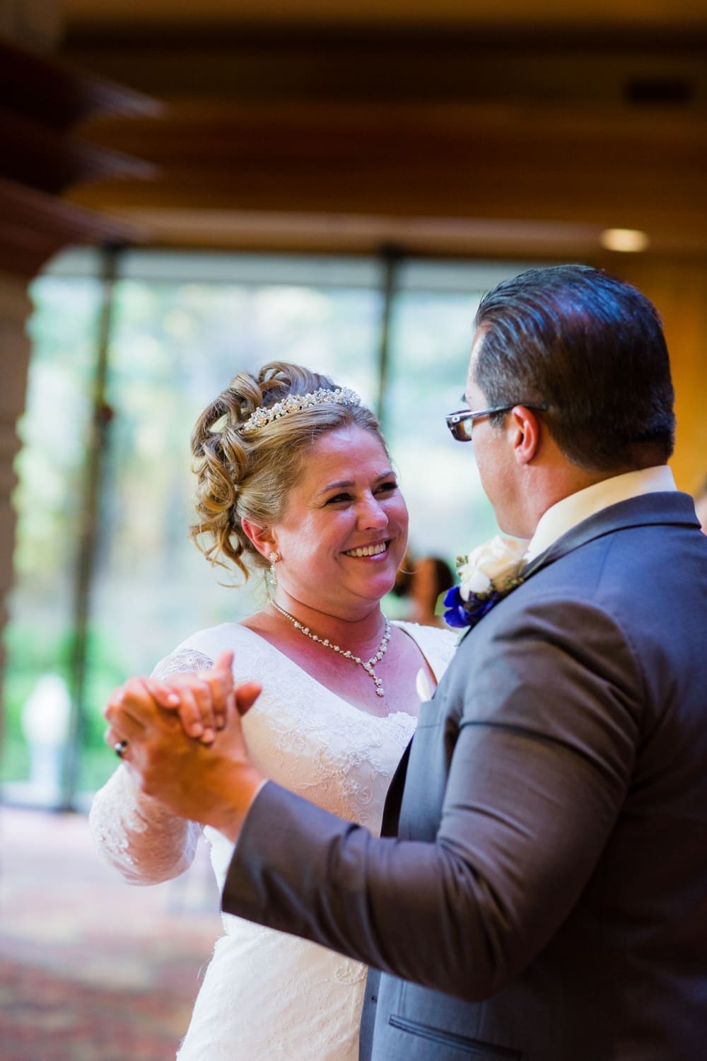Bride smiling during her first dance at Dove Canyon Golf Club wedding in Orange County, CA