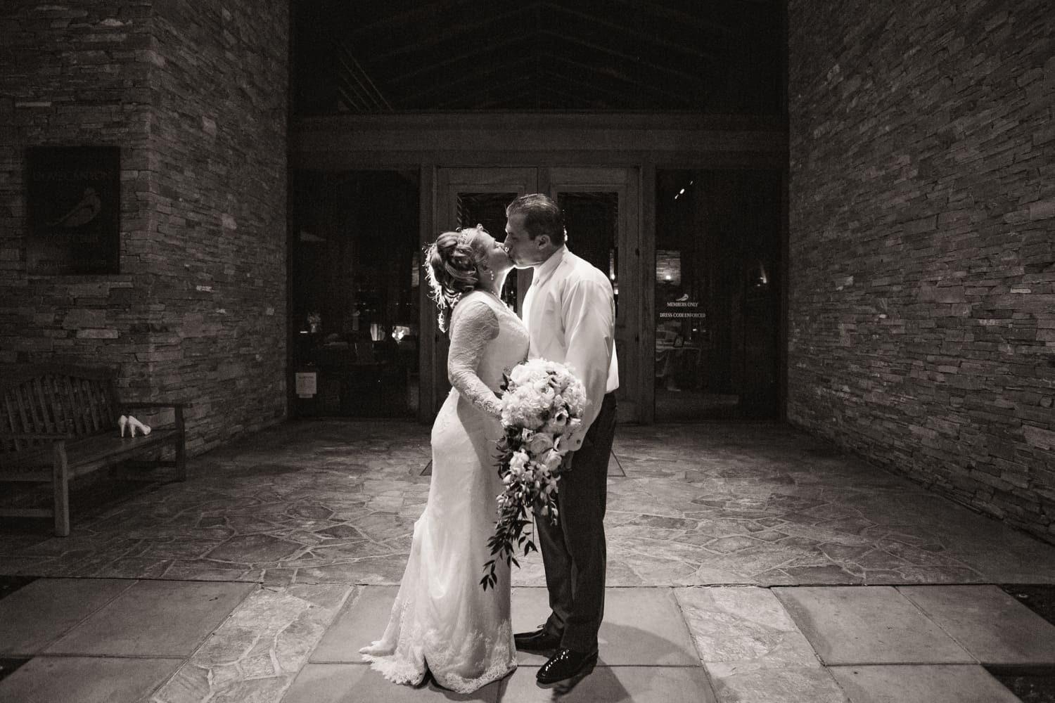 Newlyweds share a kiss at their Dove Canyon Golf Club wedding in Orange County, CA