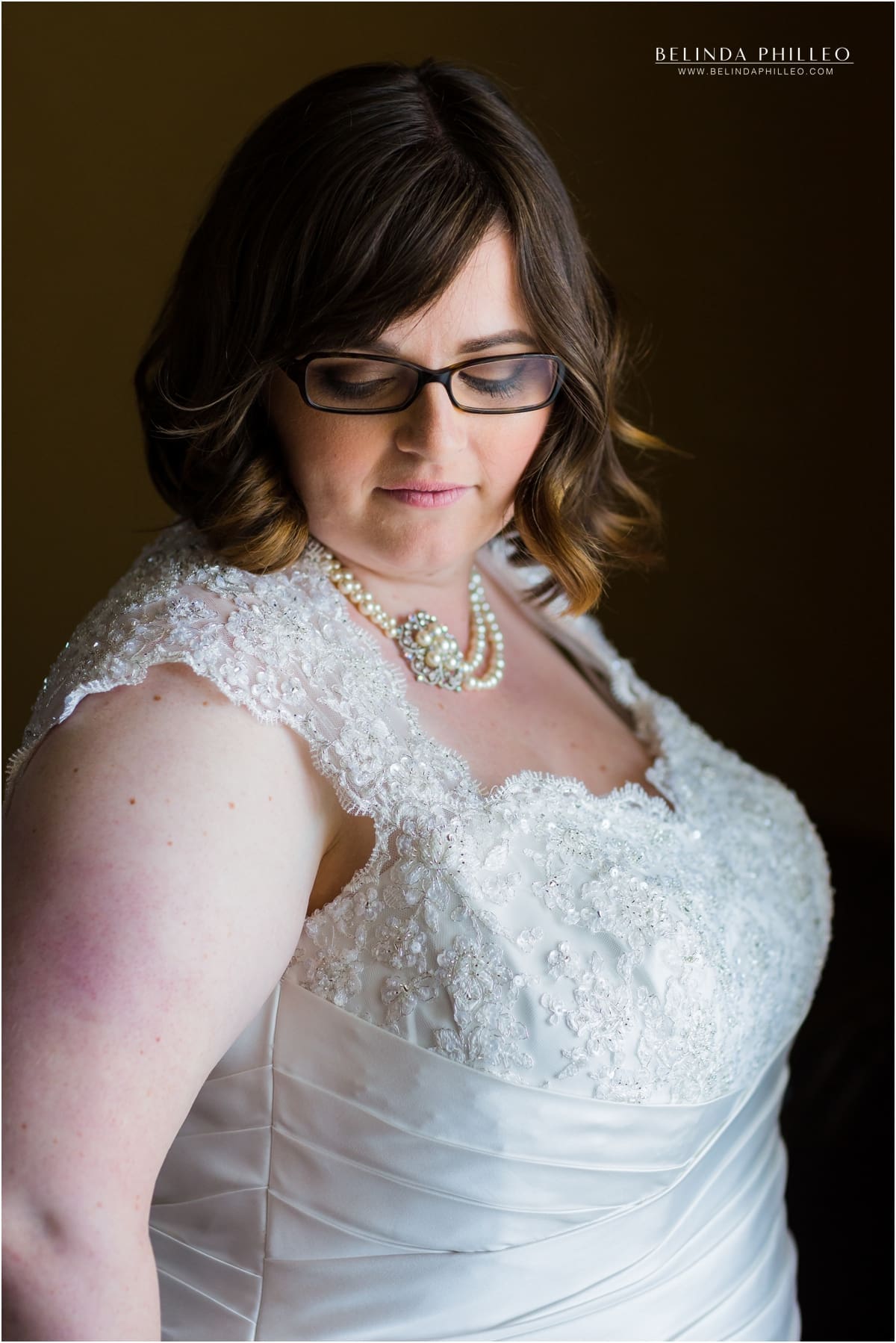 Bride takes a quiet moment to reflect before her El Dorado Park Golf Course wedding