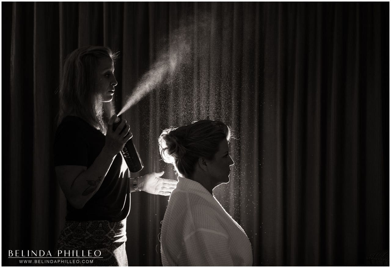 Bride gets her hair done before ceremony