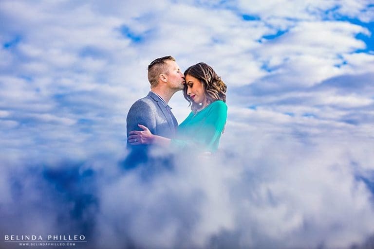 Romantic cloud reflection engagement photo in downtown santa ana. photography by Belinda Philleo