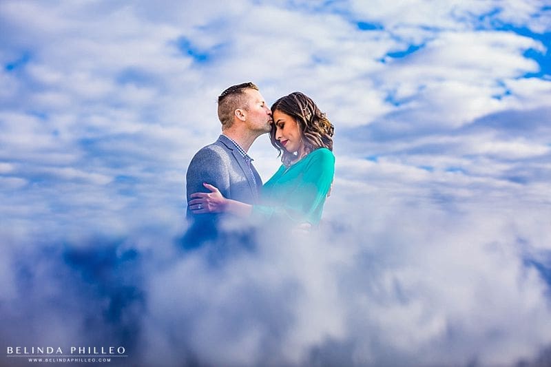 Romantic cloud reflection engagement photo in downtown santa ana. photography by Belinda Philleo
