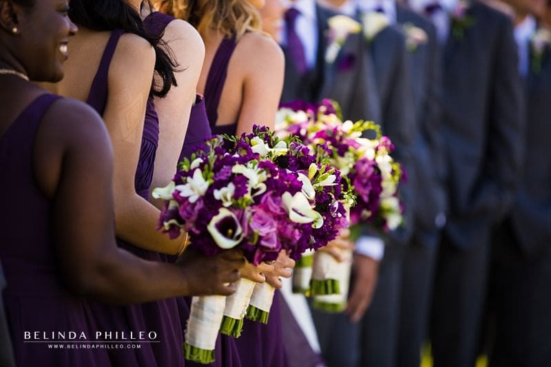 Purple and white bridesmaid bouquets at Laguna Cliffs Marriott wedding