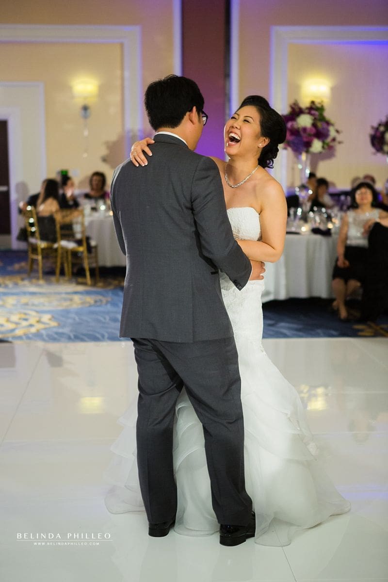 Bride and groom share their first dace at their Laguna Cliffs Marriott wedding in Dana Point, CA