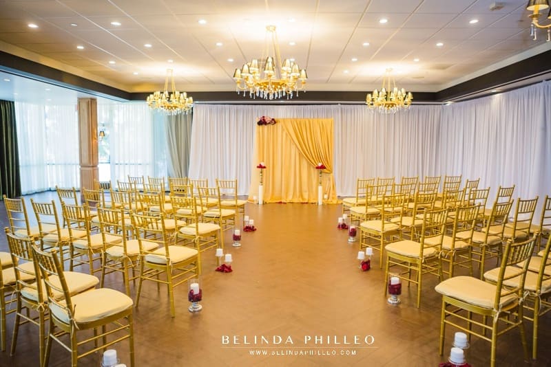 Red and gold ceremony decor at the Hills Hotel Laguna