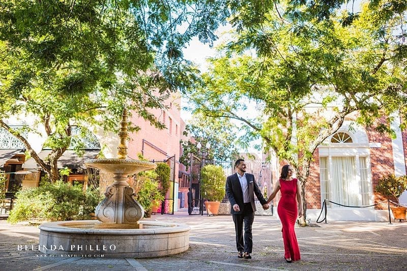 Engagement Session Locations in Orange County. A couple in formal attire takes a stroll down 2nd Street in Santa Ana during their engagement session.