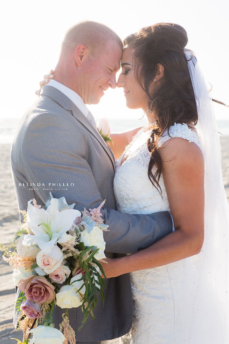 Bride and groom portraits at Huntington Beach wedding by Belinda Philleo