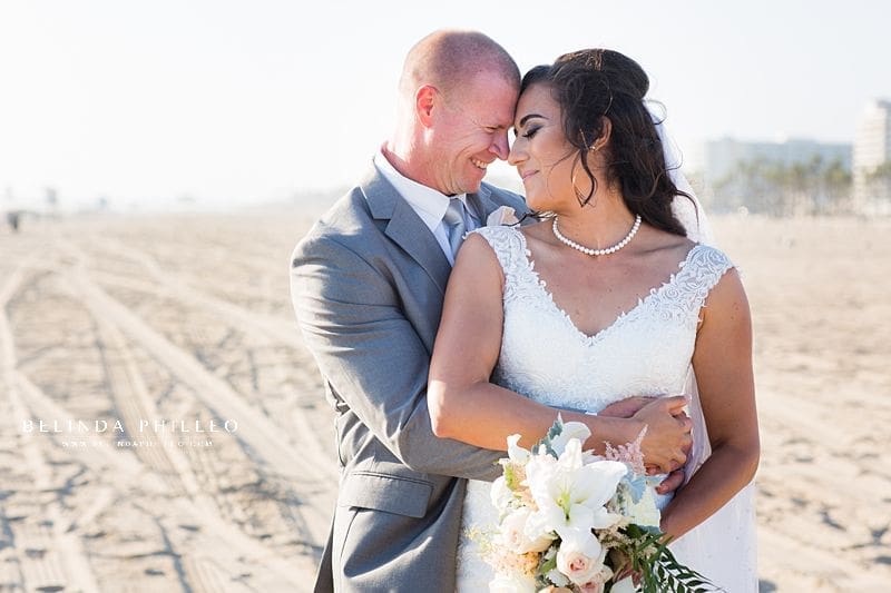 Bride and groom share a romantic moment after their Huntington Beach Wedding