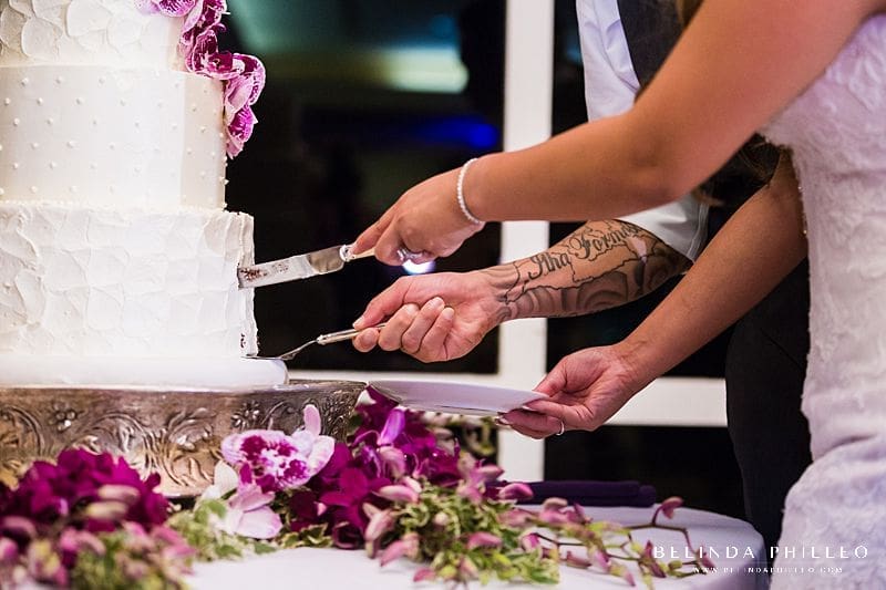 Bride and groom cut their cake from Simply Irresistible Cakes & Catering at their Friendly Hills Country Club wedding