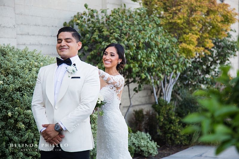 Bride and groom share intimate first look photos outside St John's Episcopal Cathedral in Downtown Los Angeles. Photography by Belinda Philleo