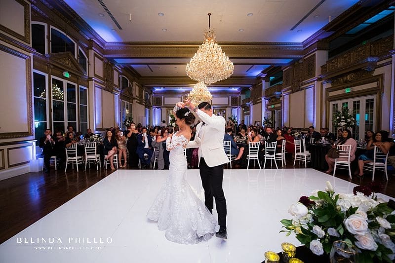 Bride and groom share their first dance during their wedding at Alexandria Ballrooms in Downtown LA. Photography by Belinda Philleo