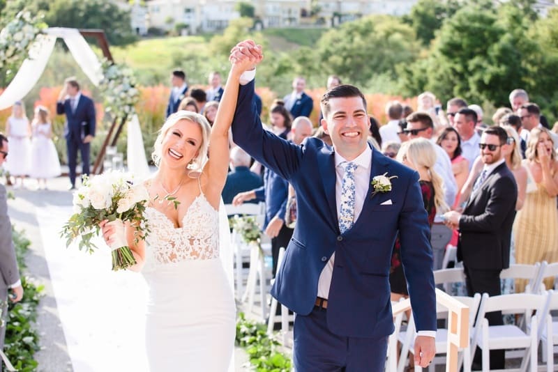 Newlyweds cheer in celebration at their Coto De Caza Golf Club Wedding, Orange County, CA