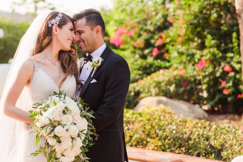 Newlyweds enjoy a sweet moment together at their Hummingbird Nest Ranch Wedding