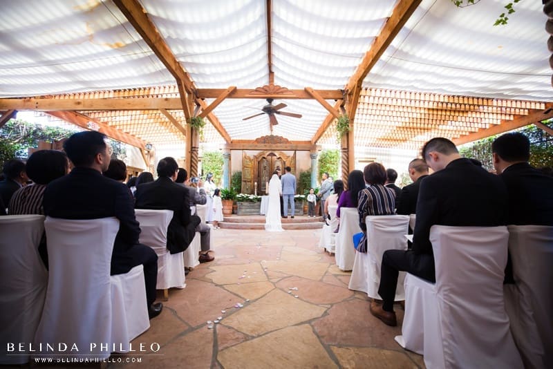 Wedding ceremony at the covered outdoor patio at The Hacienda in Santa Ana, CA