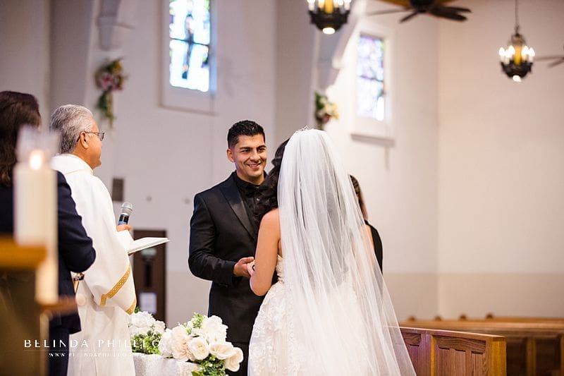 Bride and groom exchange marriage vows during their Westminster wedding ceremony. Photo by Belinda Philleo