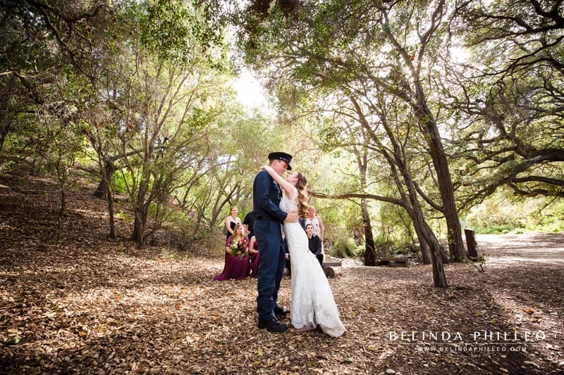 Bride and groom share their first dance while family watches at Oak Canyon Nature Center in Anaheim, CA
