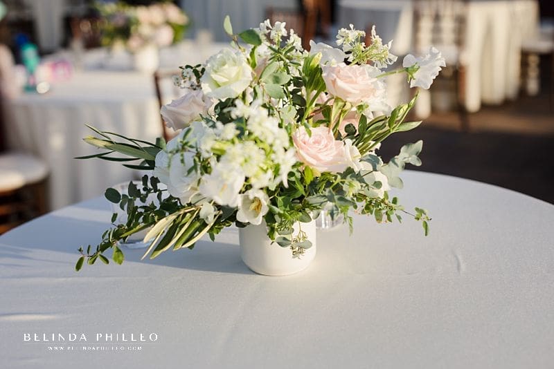 White and blush centerpieces at Strawberry Farms Golf Club wedding celebration