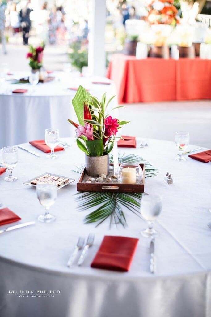 Orange and tropical wedding reception decor