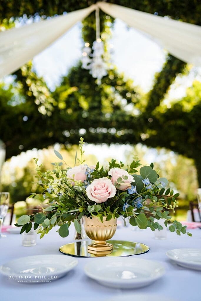 Blush and blue centerpieces with eucalyptus greens at Coyote Hills Golf Course wedding in Fullerton, CA