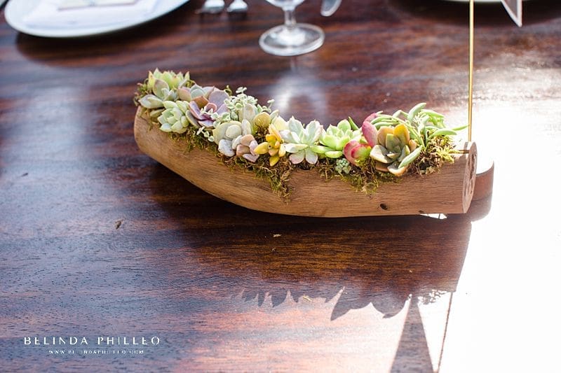 Succulent wedding reception centerpieces in wood