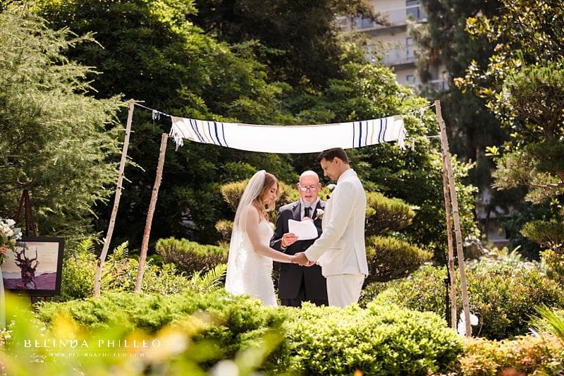 Couple marries under a chuppah at JACCC garden wedding in Los Angeles, CA