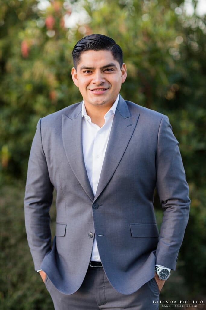 Posing tips for men from Southern California wedding photographer Belinda Philleo. A photograph of a man in a suit.