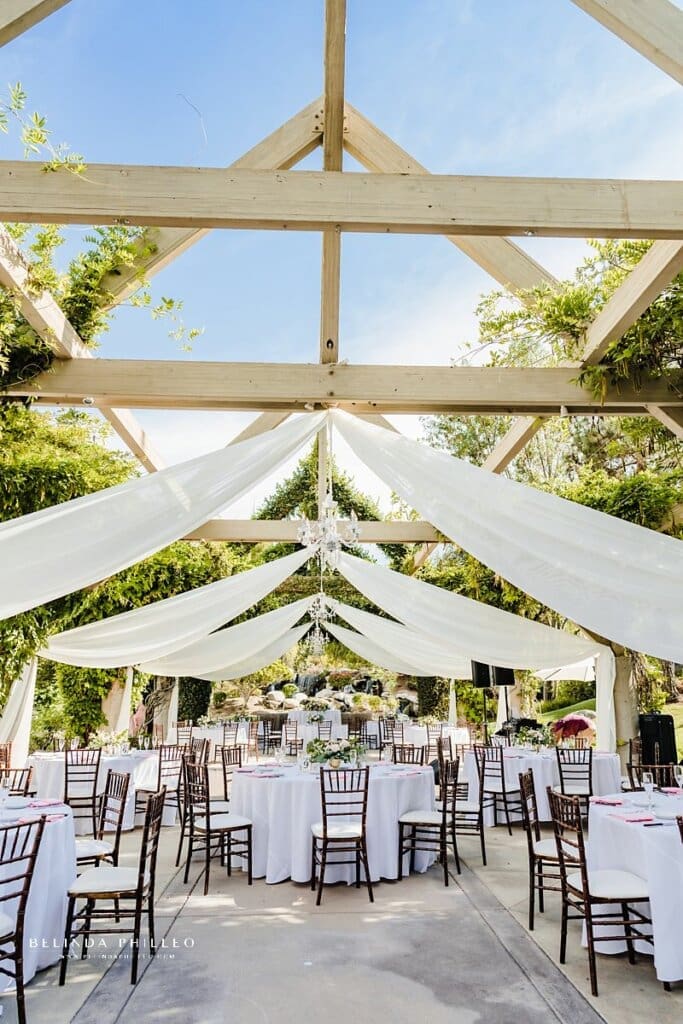 Pergola decorated for an outdoor reception at Coyote Hills Golf Club in Fullerton, CA