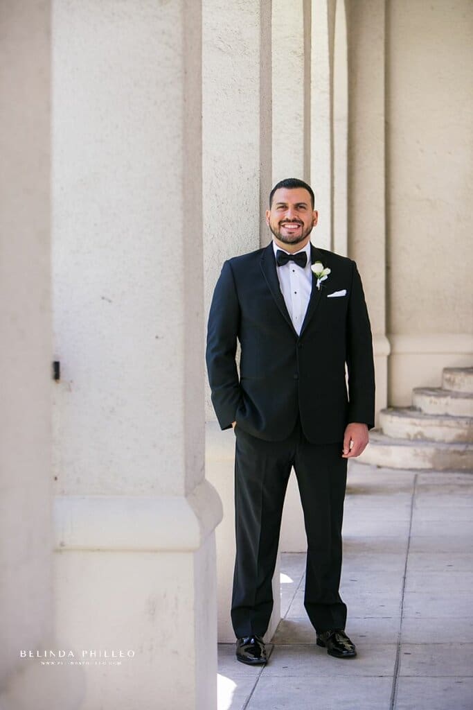 A man poses for a photo before his wedding in Los Angeles, CA. Belinda Philleo, a Southern California wedding photographer shares her best posing tips for men.