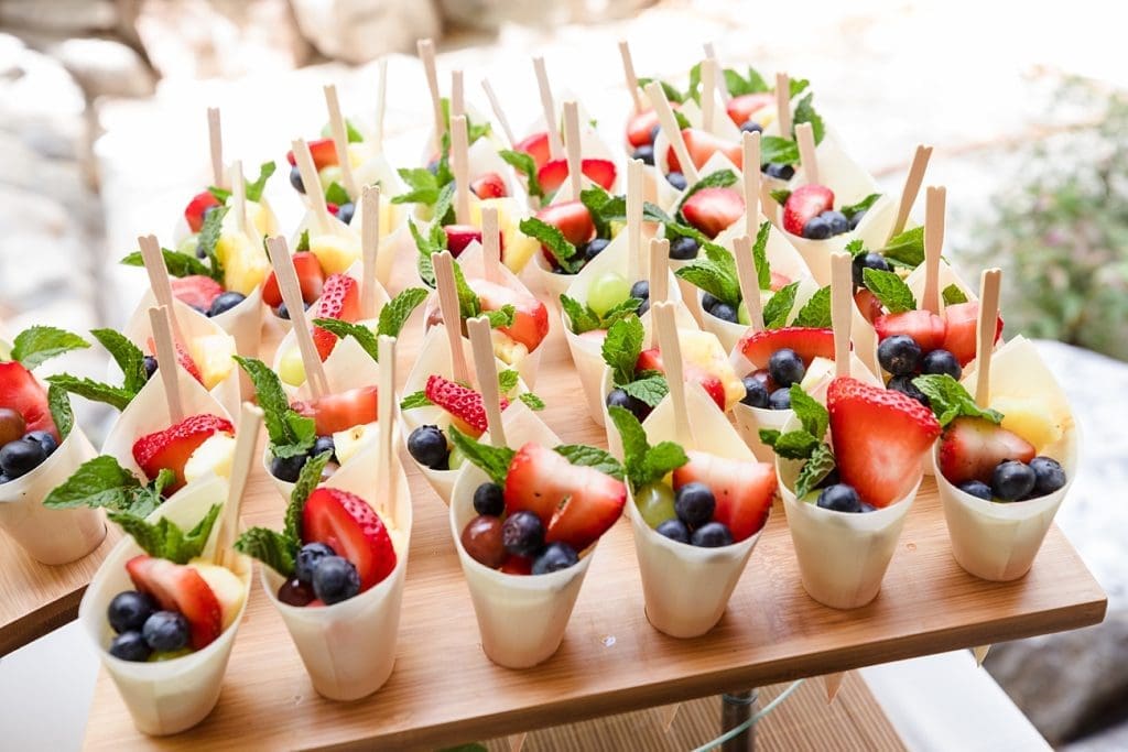 Summer fruit cups at cocktail hour during a summer wedding