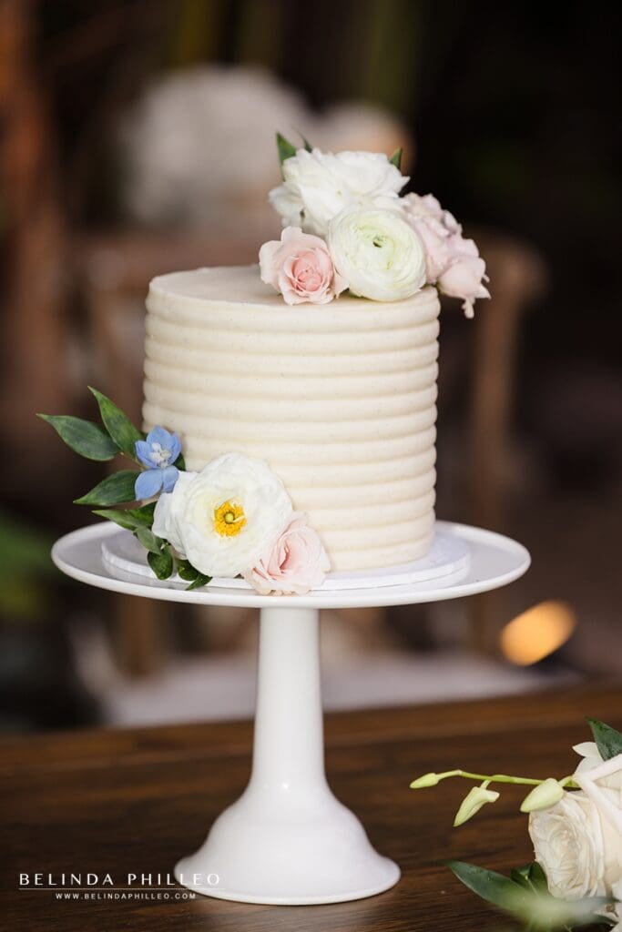 Small white cake decorated with flowers